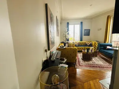 Coin salon dans l'établissement Appartement NY in Paris with love