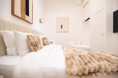 Un ou plusieurs lits dans un hébergement de l'établissement CIA - Chic Flat in Marais with AC