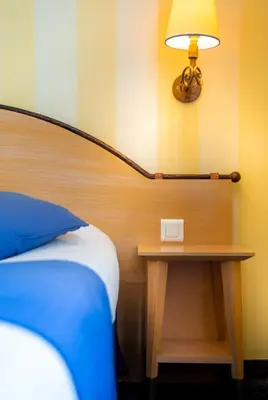Un ou plusieurs lits dans un hébergement de l'établissement Hotel Delambre