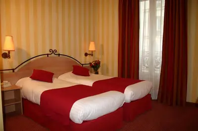 Un ou plusieurs lits dans un hébergement de l'établissement Hotel Delambre