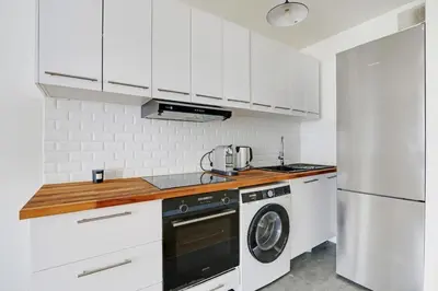 Cuisine ou kitchenette dans l'établissement Au pied de l'arche