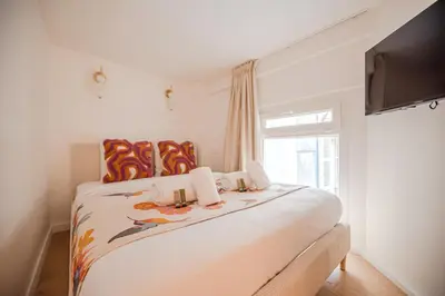 Un ou plusieurs lits dans un hébergement de l'établissement CIA - Cozy Flat Palais Royal, Louvre