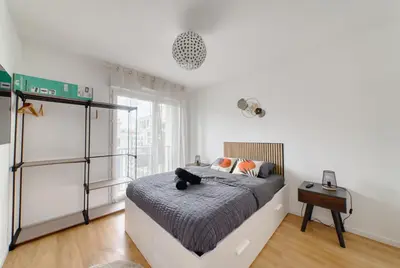 Un ou plusieurs lits dans un hébergement de l'établissement Appartement prestige 5 personnes