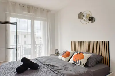Un ou plusieurs lits dans un hébergement de l'établissement Appartement prestige 5 personnes