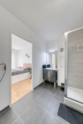 Un ou plusieurs lits dans un hébergement de l'établissement Appartement prestige 5 personnes