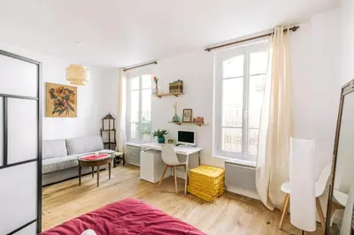 Un ou plusieurs lits dans un hébergement de l'établissement GuestReady - Stylish comfort near Montsouris