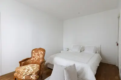 Un ou plusieurs lits dans un hébergement de l'établissement Bright apartment for 4