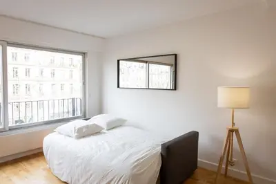 Un ou plusieurs lits dans un hébergement de l'établissement Charming Studio