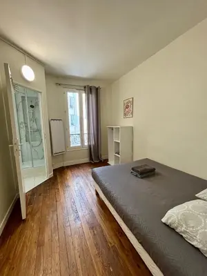 Un ou plusieurs lits dans un hébergement de l'établissement Appartement Commerce Tour Eiffel