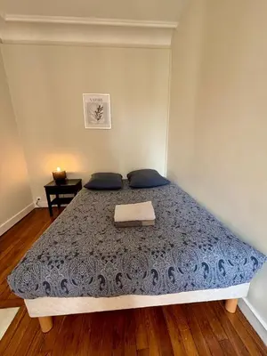 Un ou plusieurs lits dans un hébergement de l'établissement Appartement Commerce Tour Eiffel