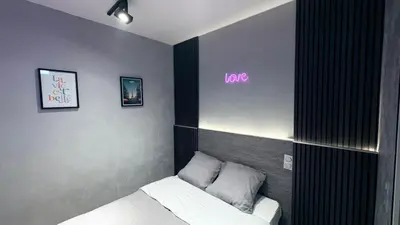Un ou plusieurs lits dans un hébergement de l'établissement Hotel de Touraine Belleville
