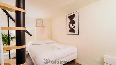 Un ou plusieurs lits dans un hébergement de l'établissement Paris Expo - Charming Apartment - GetHosted