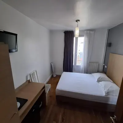 Un ou plusieurs lits dans un hébergement de l'établissement Hotel de L'Union