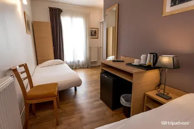 Un ou plusieurs lits dans un hébergement de l'établissement Hotel de L'Union