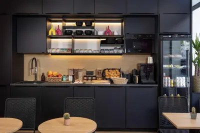 Cuisine ou kitchenette dans l'établissement Hôtel Korner Châtelet