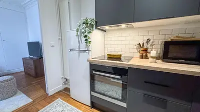 Cuisine ou kitchenette dans l'établissement Le Repaire Tranquille
