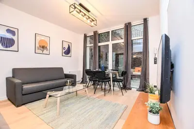 Coin salon dans l'établissement Duplex agréable Paris 20ᵉ - Belleville