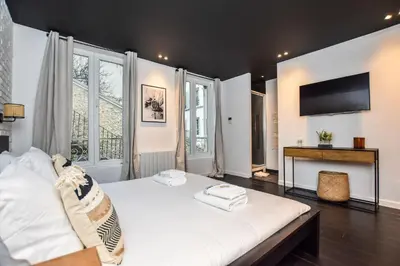 Un ou plusieurs lits dans un hébergement de l'établissement Duplex agréable Paris 20ᵉ - Belleville