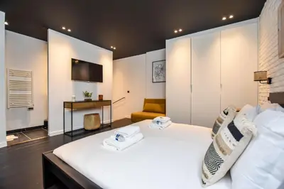 Un ou plusieurs lits dans un hébergement de l'établissement Duplex agréable Paris 20ᵉ - Belleville