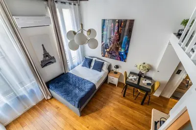 Un ou plusieurs lits dans un hébergement de l'établissement Lovely flat, center of Paris