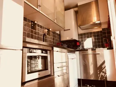 Cuisine ou kitchenette dans l'établissement Duplex de Luxe