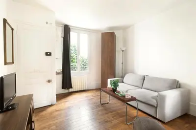 Coin salon dans l'établissement Bright & Chic apartment Near Porte Maillot - 4P