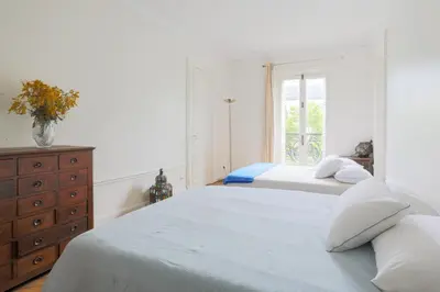 Un ou plusieurs lits dans un hébergement de l'établissement luxueux Appartement paris 6