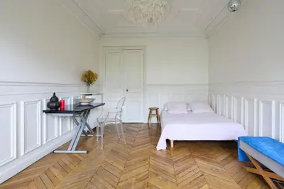 Un ou plusieurs lits dans un hébergement de l'établissement luxueux Appartement paris 6
