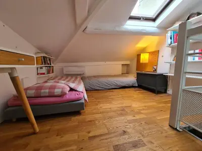 Un ou plusieurs lits dans un hébergement de l'établissement Appartement parisien en bas de Montmatre