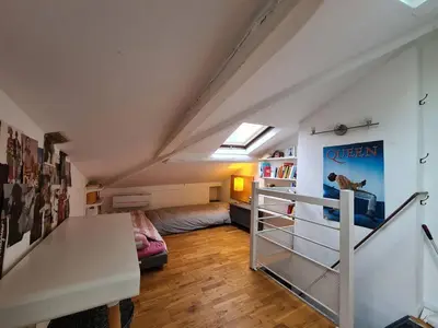 Un ou plusieurs lits dans un hébergement de l'établissement Appartement parisien en bas de Montmatre