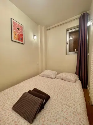 Un ou plusieurs lits dans un hébergement de l'établissement Appartement Montparnasse 3