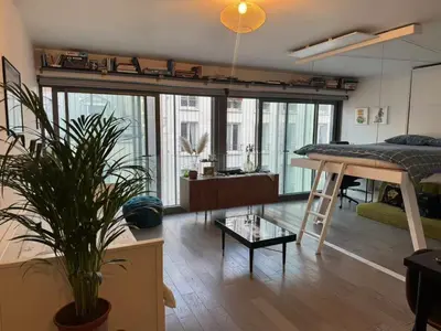 Coin salon dans l'établissement Cozy appartement well located