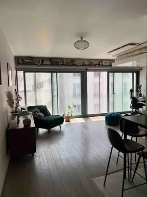 Coin salon dans l'établissement Cozy appartement well located
