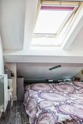 Un ou plusieurs lits dans un hébergement de l'établissement Coeur de Paris sous les toits
