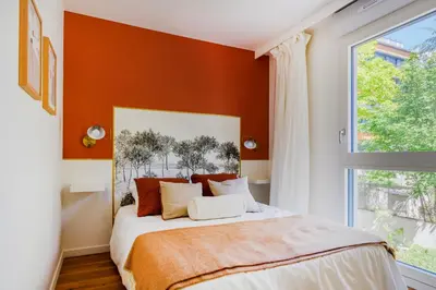 Un ou plusieurs lits dans un hébergement de l'établissement Paris West Elegant residence