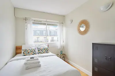 Un ou plusieurs lits dans un hébergement de l'établissement 2 bedroom flat Centre de Paris - Eiffel Tower view