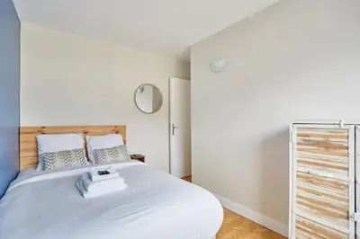 Un ou plusieurs lits dans un hébergement de l'établissement 2 bedroom flat Centre de Paris - Eiffel Tower view