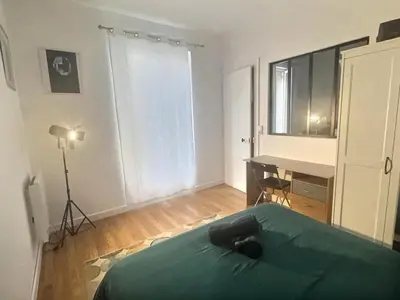 Un ou plusieurs lits dans un hébergement de l'établissement Appartement lumineux aux portes de Paris Séjour longue durée idéal Pour Couple & Professionnels