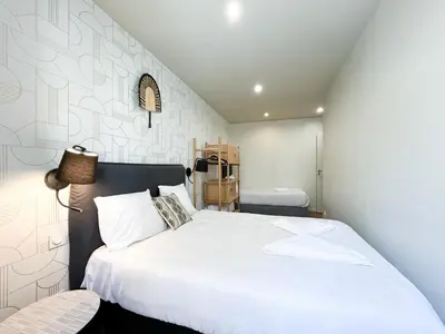 Un ou plusieurs lits dans un hébergement de l'établissement Urban Flat 02 - 4 Bedrooms Flat in center of Paris