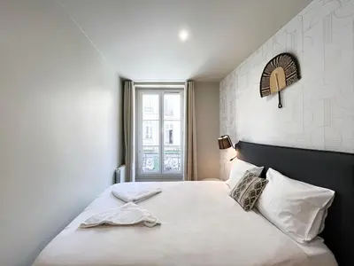 Un ou plusieurs lits dans un hébergement de l'établissement Urban Flat 02 - 4 Bedrooms Flat in center of Paris