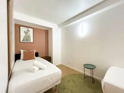 Un ou plusieurs lits dans un hébergement de l'établissement Urban Flat 194 - Cosy 3 Bedroom Opera Grands Boulevards