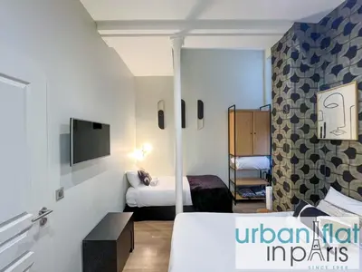 Un ou plusieurs lits dans un hébergement de l'établissement Urban Flat 62 - Beautiful Apartment Mermoz Champs-Elysees