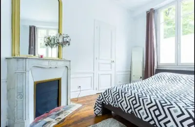 Un ou plusieurs lits dans un hébergement de l'établissement 3 pièces Arc de Triomphe RDC