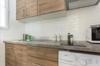Cuisine ou kitchenette dans l'établissement 3 pièces Arc de Triomphe RDC