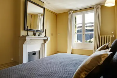 Un ou plusieurs lits dans un hébergement de l'établissement Paris Louvre Elegant residence