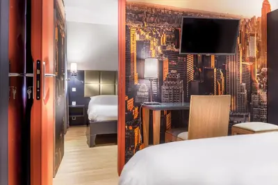Un ou plusieurs lits dans un hébergement de l'établissement Hotel Jenner