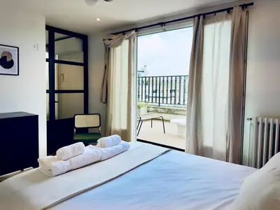 Un ou plusieurs lits dans un hébergement de l'établissement Cocoon 6p, Terrace with Eiffel Tower & Seine View