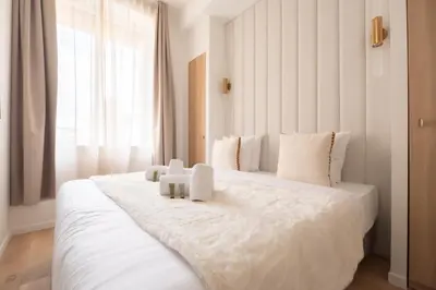 Un ou plusieurs lits dans un hébergement de l'établissement Chic Flat in Paris Center