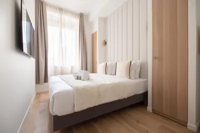 Un ou plusieurs lits dans un hébergement de l'établissement Chic Flat in Paris Center
