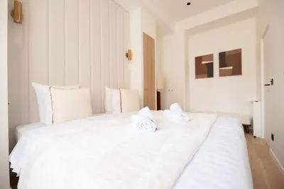 Un ou plusieurs lits dans un hébergement de l'établissement Chic Flat in Paris Center